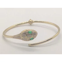 Felül nyitott alul rugósan nyíló arany karkötő, melynek díszítése egy gyönyörüen megformázott cirkon kővel díszített kígyófej van